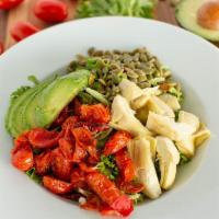 Basil Vin Salad · Fresh spring mix and baby arugula, avocado, roasted tomatoes, pumpkin seeds, artichoke heart...