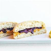 Kids PB＆J · Creamy peanut butter and blueberry jam on wheat ciabatta bread. Served with a side of fruit.