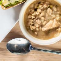 White Bean Chicken Chili · A gluten free creamy chili flavor forward with white beans, roasted chicken,  green peppers,...