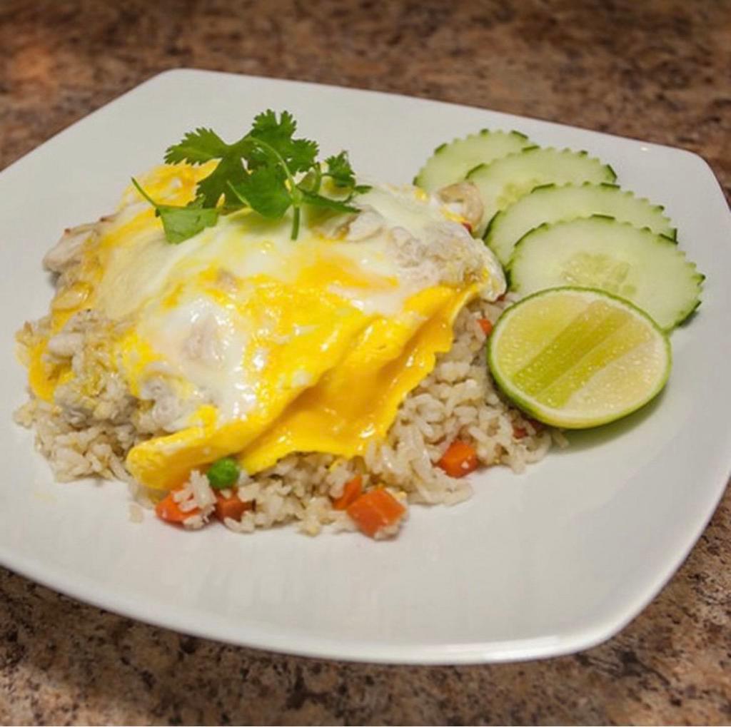 Crab Fried Rice · Jasmine rice stir-fried with egg, crab meat, peas, carrots, and scallion. Fried rice dishes are cooked to order.