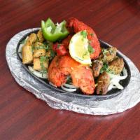 Mix Combo Kabob · Beef, chicken and lamb combined with special spices and herbs, skewered.