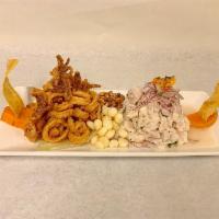 Ceviche 2 en 1 ( fish ceviche with fried calamari) · Peruvian style fish ceviche marinated in lime juice with fried calamari 