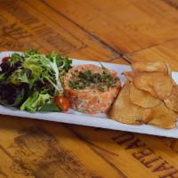 Tartare de Saumon  · Salmon with capers, Tobasco, cornichons and shallots. Served with homemade potato chips. 