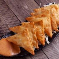 Crab Rangoons · 6 pieces. Deep-fried wonton wrappers filled with cream cheese and imitation crab. Comes with...