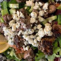 Grilled Lamb Salad · Comes with bleu cheese crumbles, tomatoes, onions and cucumbers.