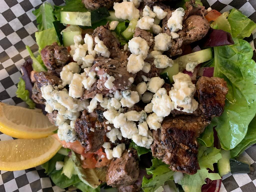 Grilled Lamb Salad · Comes with bleu cheese crumbles, tomatoes, onions and cucumbers.