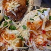 Fish Taco · 3 tacos. Beer battered Icelandic Cod with lettuce, Jack cheese and sweet Thai chili sauce.