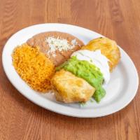 Chimichanga Plate · Rice beans, cheese, meat, topped with sour cream and guacamole.
