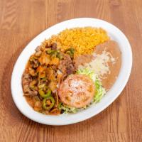 Steak Ranchero Plate · Steak grilled with jalapenos, green onions and tomato sauce, choice of tortillas.