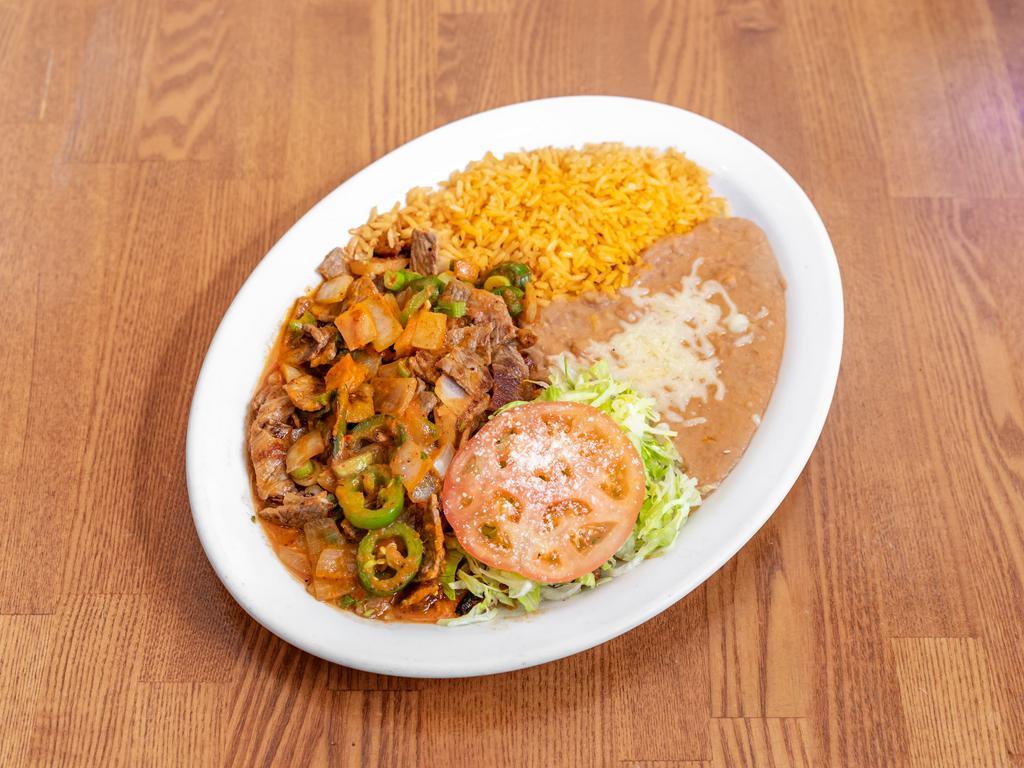 Steak Ranchero Plate · Steak grilled with jalapenos, green onions and tomato sauce, choice of tortillas.