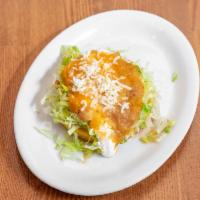 Sopes · A thick and consistent fried corn tortilla with beans, lettuce, sour cream, cheese, salsa an...