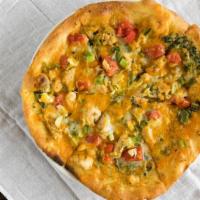 Florentino Pizza · Asiago creamed spinach, sliced chicken, jalapeno bacon, jalapenos, tomatoes, artichokes, gre...