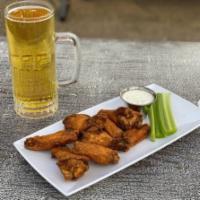 Jumbo Wings · Fresh jumbo wings tossed in your choice of sauce. Served with celery sticks and a dressing c...