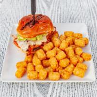 California Fried Chicken Sandwich · Hand-breaded fried chicken breast. Topped with bacon, pepper jack, and guacamole. Served wit...