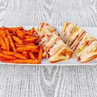Turkey Club Sandwich · Triple decker, turkey breast, bacon, lettuce, tomato and mayo on your choice of toasted whit...
