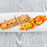 Key West Shrimp · Pan-fried with our delicious champagne dill cream sauce. Served over a bed of rice and veget...