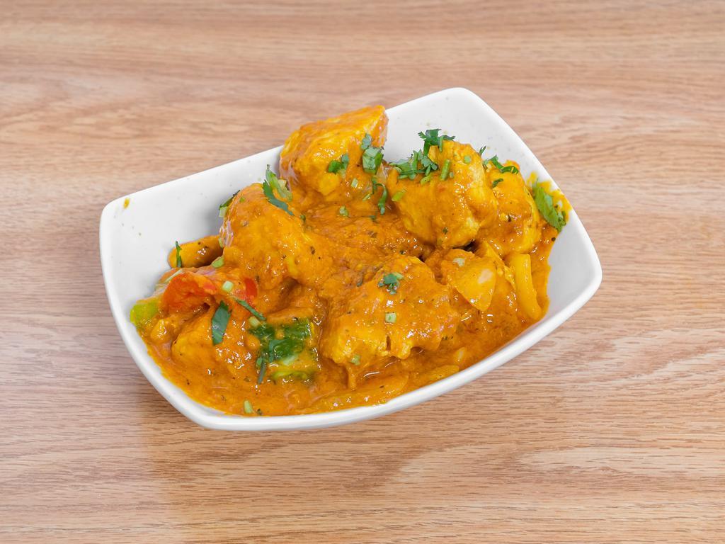 Karahi Chicken · Tender cubes of chicken simmered in sauce of fresh tomatoes and exotic herb.