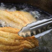 Catfish Meal · Deliciously fried Catfish battered in house seasoned to perfection and tender white meat in ...