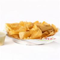 Chips & Queso · Individual portion of our wildly addictive chips & creamy queso.

