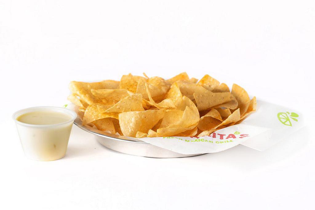 Chips & Queso · Individual portion of our wildly addictive chips & creamy queso.
