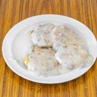 Biscuit and Gravy · Buttermilk biscuit smothered in our country sausage pepper gravy.