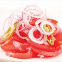 Achichuk · Traditional Uzbek salad of thin sliced tomatoes, hot pepper and onion.