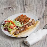 Lamb Kebab Plate · comes with a side of raw onion, rice, Greek salad and lavash