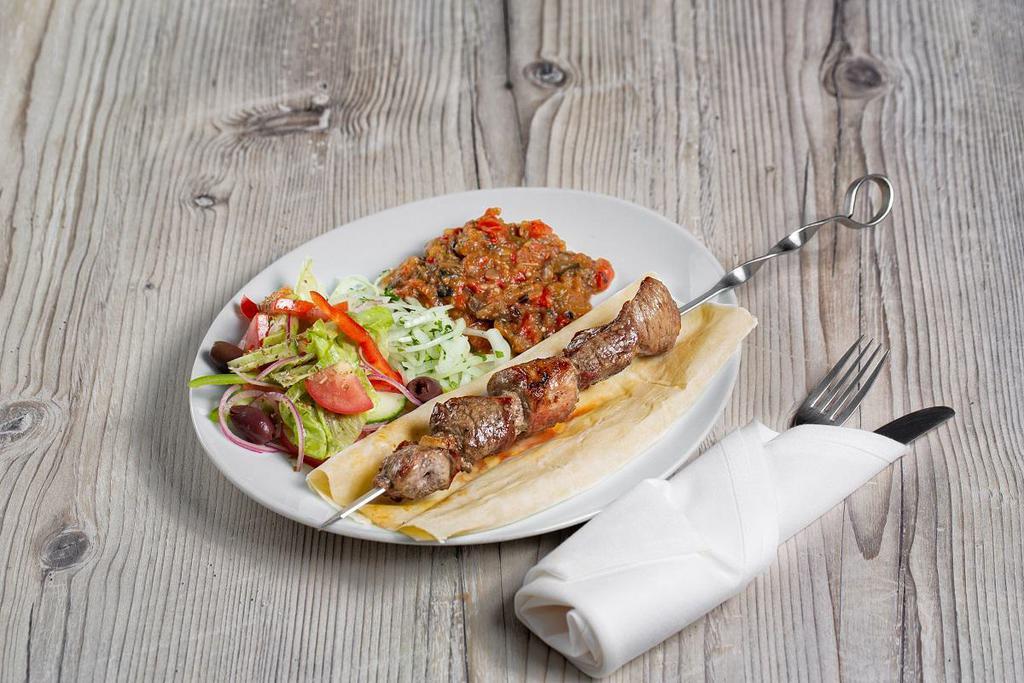 Lamb Kebab Plate · comes with a side of raw onion, rice, Greek salad and lavash
