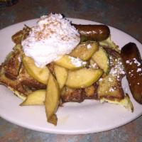 Apple Pandora French Toast · French toast style cinnamon toast with apple slices. Garnished with powdered sugar and Devon...