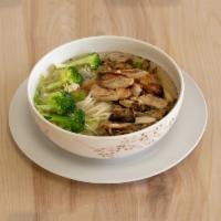 Udon · Udon noodles, vegetables, chicken, and fish cake in special oriental soup.
