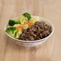 Teriyaki Beef Bowl · Thinly sliced beef served over rice and steamed vegetables. Served with steamed rice and veg...