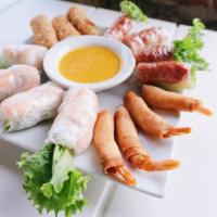 23. APPETIZER SAMPLER · Spring roll(2), egg roll(3), summer roll(2), rocket shrimp(4)