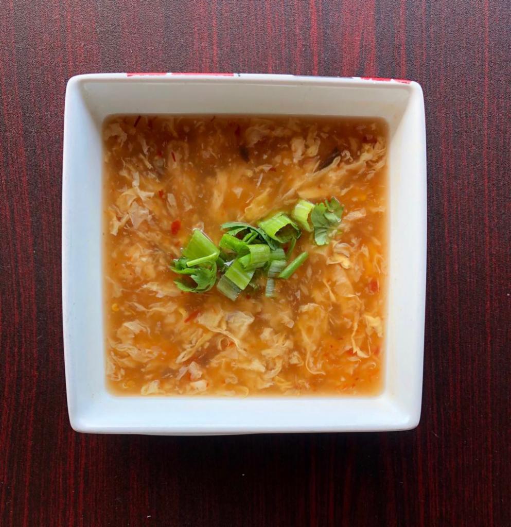 Hot & Sour Soup · Water-chestnuts, black mushrooms, Bamboo shoots, green onions and chicken.