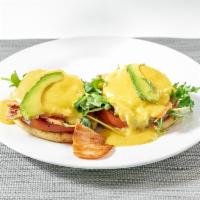 Smoked Salmon Benedict  · Two poached eggs, grilled round tomatoes, organic arugula and avocado on an English muffin a...