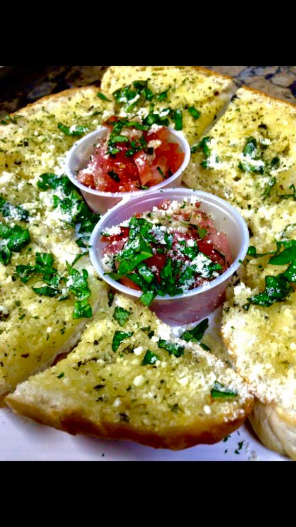 Bruschetta · Toasted garlic bread served with diced roma tomatoes, basil and garlic.