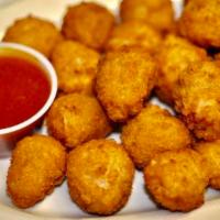 Breaded Mushrooms · Fresh whole button mushrooms lightly marinated in roasted garlic then breaded with golden cr...