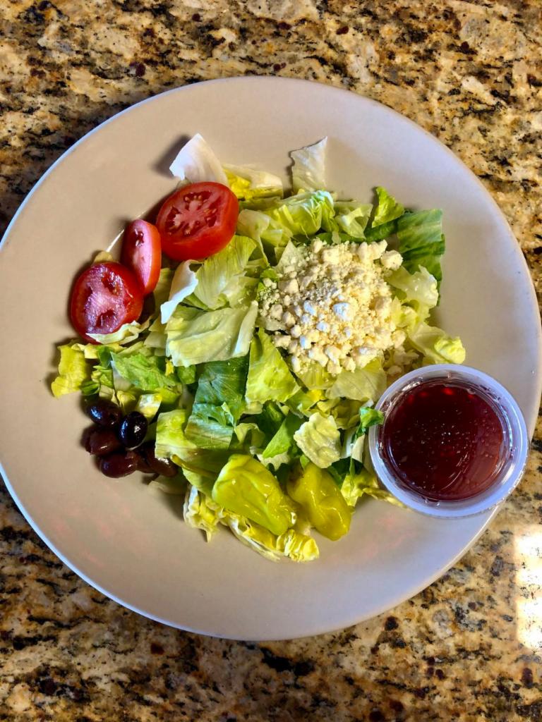 Greek Salad · Lettuce, tomatoes, feta cheese, kalamata olives, pepperoncini peppers with toasted dinner bread and Greek dressing or your choice of salad dressing on the side