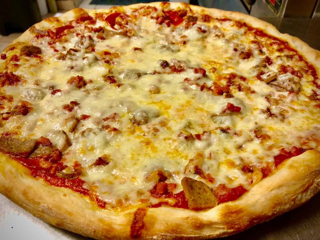 Meat Lovers Pizza · Pepperoni, sausage, meatballs, bacon, ham and extra cheese.
