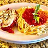 Chicken Parmigiana · Breaded tender chicken breast topped with with marinara and mozzarella cheese. Served with a...