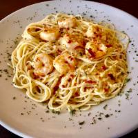 Shrimp Picatta · Spaghetti with shrimp, lemon butter sauce, caper, and mushrooms.