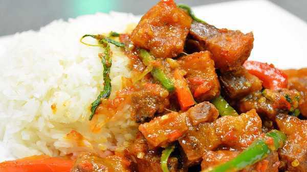 79. Stir Fried Spicy Rind Pork & Rice Combo · Rind pork, basil, Thai chili and bell pepper. Spicy.