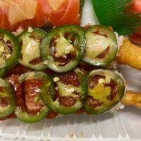 Fired Dragon Roll  · Tempura shrimp avocado roll topped with spicy tuna and jalapeno.
