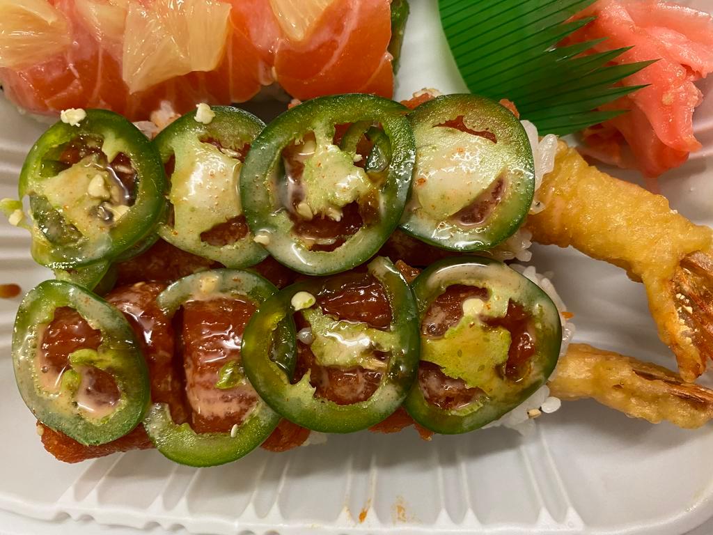 Fired Dragon Roll  · Tempura shrimp avocado roll topped with spicy tuna and jalapeno.