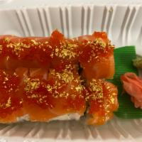 Golden Gate Roll   · Served with snow crab, avocado, topped with salmon, flying fish roe and real gold fakes.