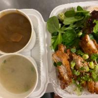 Curry Chicken Katsu Over Rice Plate · Bread chicken deep fried with curry, miso soup and green salad.
