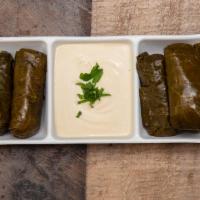 Grape Leaves · Grape leaves stuffed with rice and tahini sauce. Vegan.