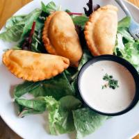 Chickpea Sambusak · Mediterranean samosa filled with spiced ground chickpeas, serve with tahini sauce.
vegan