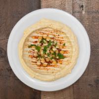Classic Bowl · Hummus, tahini, chickpeas, parsley and olive oil. Served with pita bread and a side of schug...