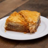 Baklava · Layered flaky filo dough filled with honey and nuts.