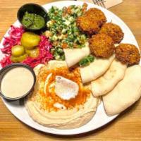 Falafel  platter (5 pcs) · Your choice of meatless protein served with hummus,
tabbouleh salad, red cabbage and pita br...